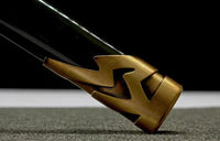 Close-up of a gold decorative object on a black background