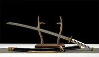 Sword with decorative sheath on a dark background