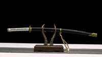 Sword on a wooden stand with a black background