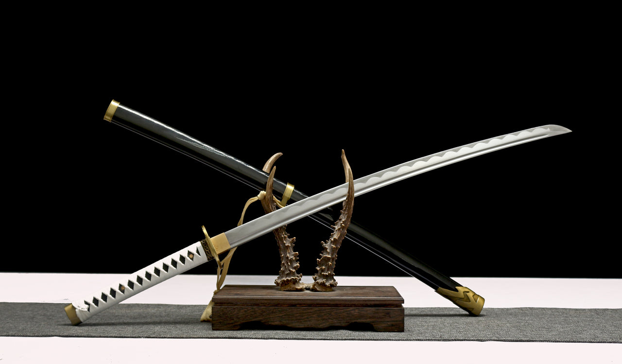 Two swords on a stand with a black background