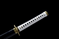 Sword with a white handle and gold accents on a black background